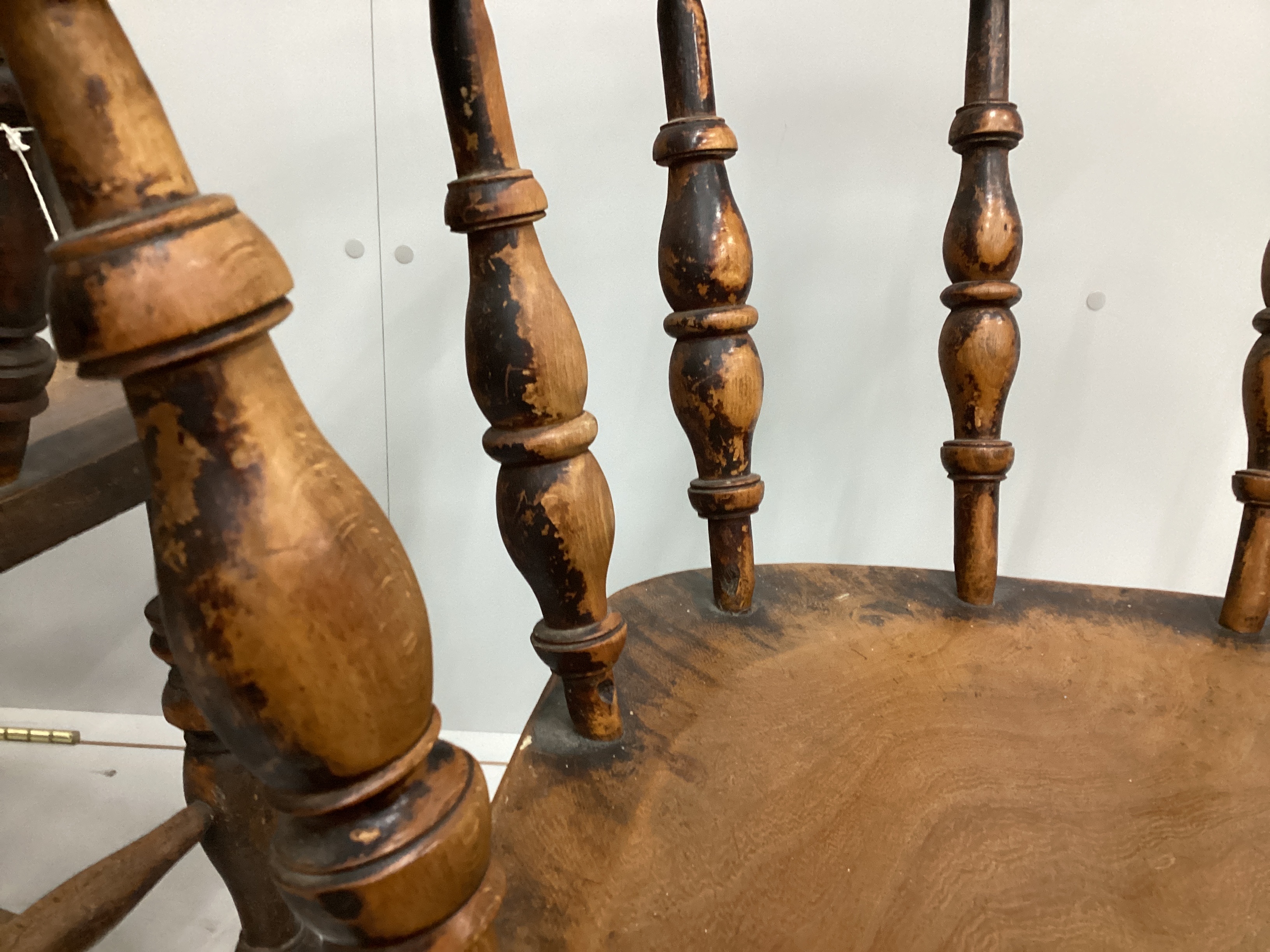 A pair of Victorian elm and beech smoker's bow elbow chairs, width 67cm, depth 50cm, height 82cm